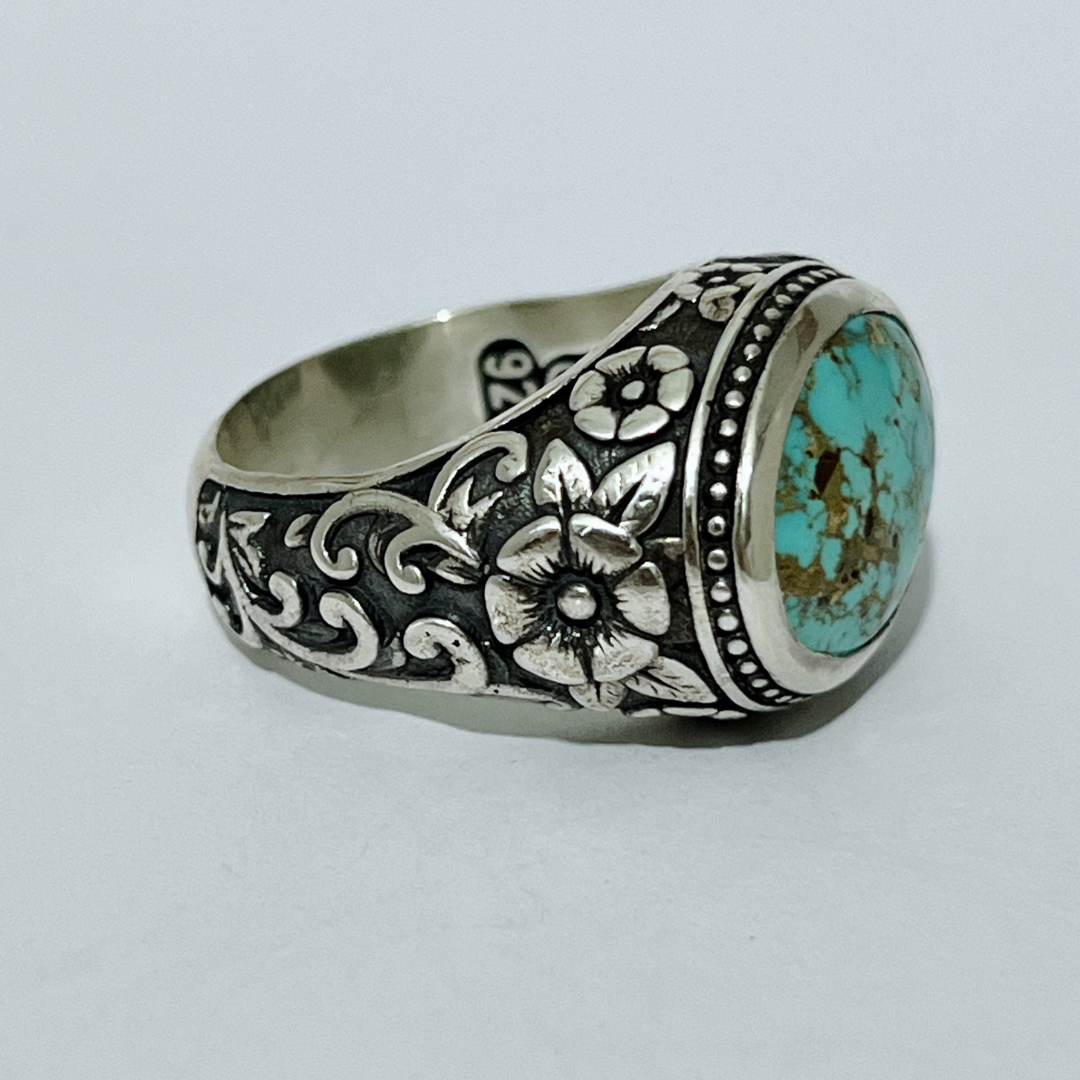 Handcrafted sterling silver floral turquoise ring with oval turquoise stone and engraved sides – Atlas Jewelry