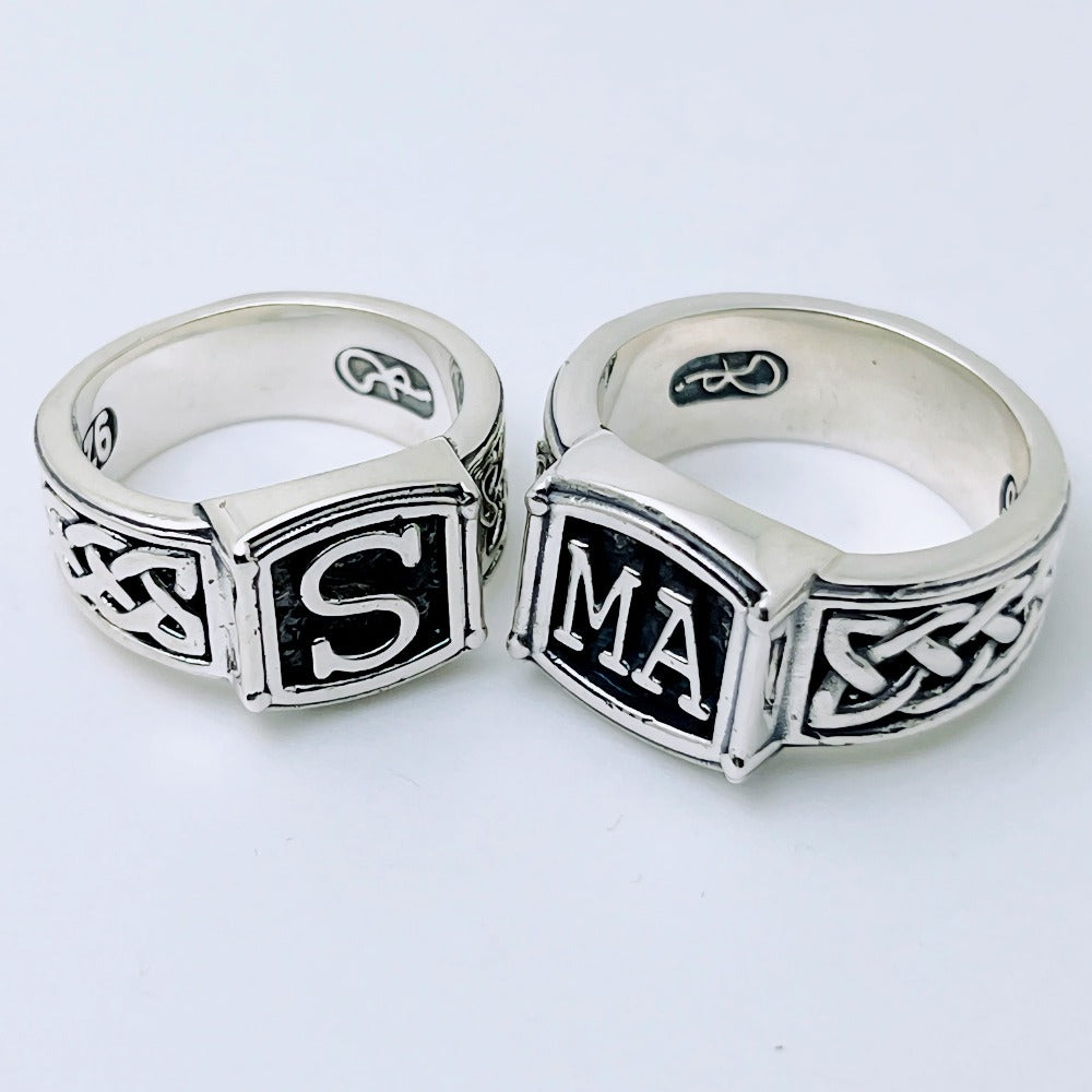 Handcrafted sterling silver initial ring with braided band and dark background – personalized family ring by Atlas Jewelry