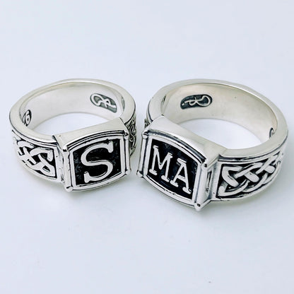 Handcrafted sterling silver initial ring with braided band and dark background – personalized family ring by Atlas Jewelry