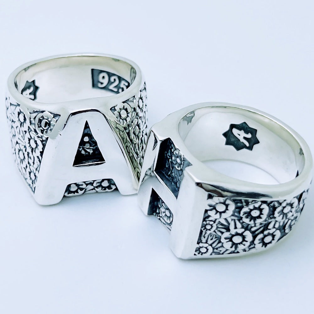Handcrafted sterling silver floral initial ring with large letter front and flower pattern sides – personalized family ring by Atlas Jewelry